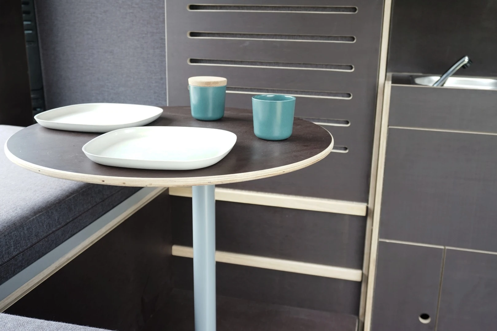 The dining area with pop-up table and L lounge