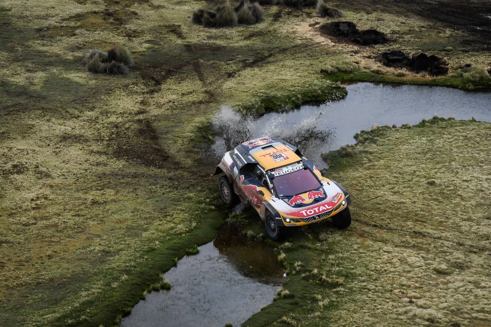 Peugeot's Peterhansel and Cottret pick a spot for a river crossing