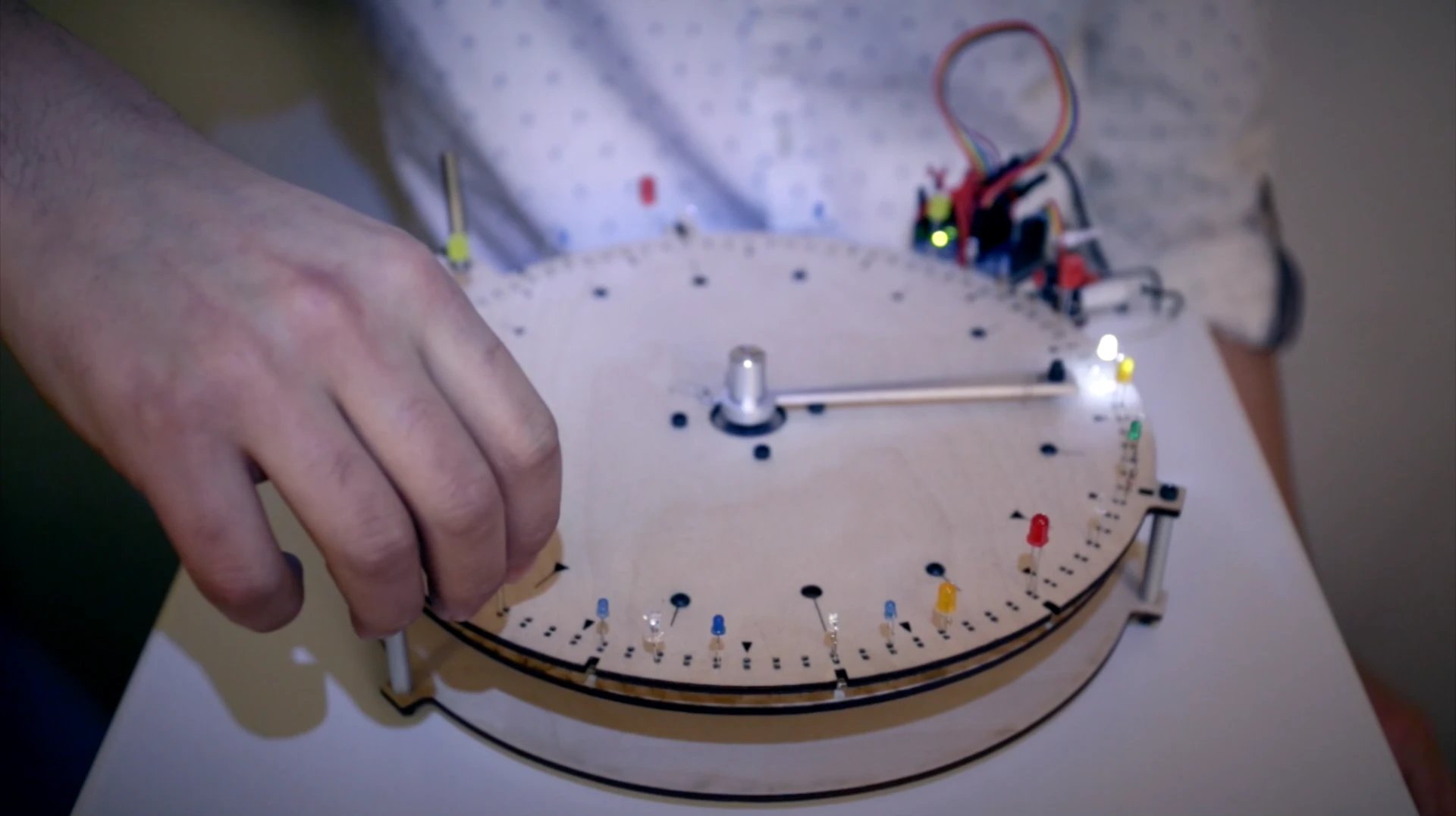 When the BlinkWheel's rotating arm comes into contact with an LED's anode, the light activates and a sound is triggered
