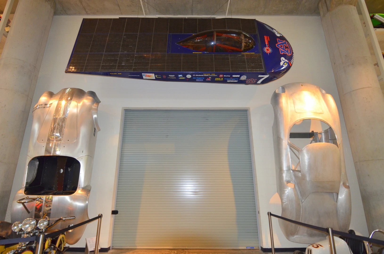 (left) Stainless steel Cobra body made in Poland, (center) Solar Challenge Car (right) Ferrari body shell