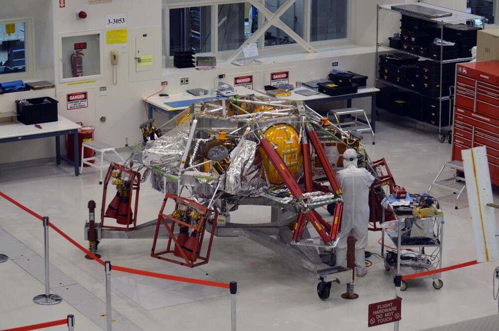 Technician's tend to the Mars 2020 lander at JPL's Spacecraft Assembly Facility