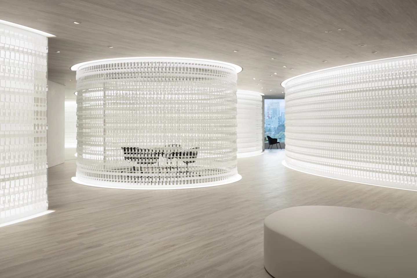 The steel replica Pokémon cards are angled to control the amount of light and views in each office area