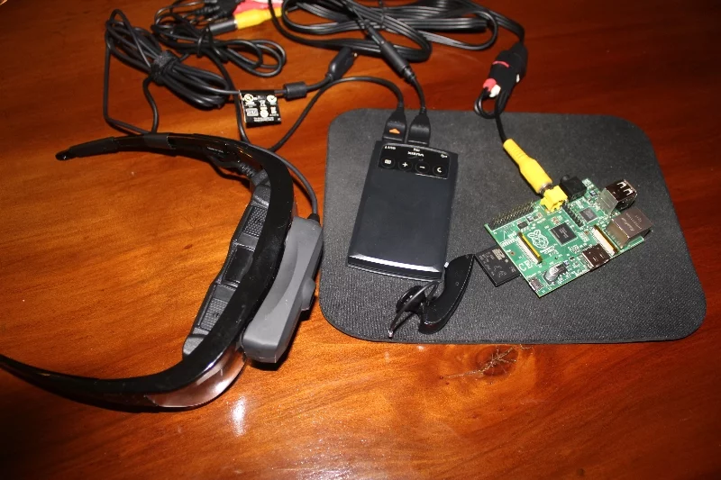 This is all a user would need to carry to use this project - minus the camera on the glasses, which was used to record the demo. The rest is handled by remote servers, reducing user load (Image: Will Powell)