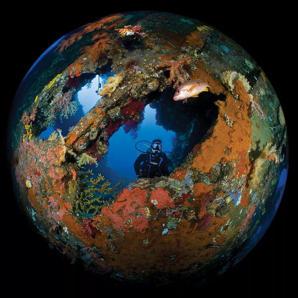 Honorable mention. An extreme wide angle lens turns the wreck of the USAT Liberty in Bali into an inventive image recalling our own planet Earth