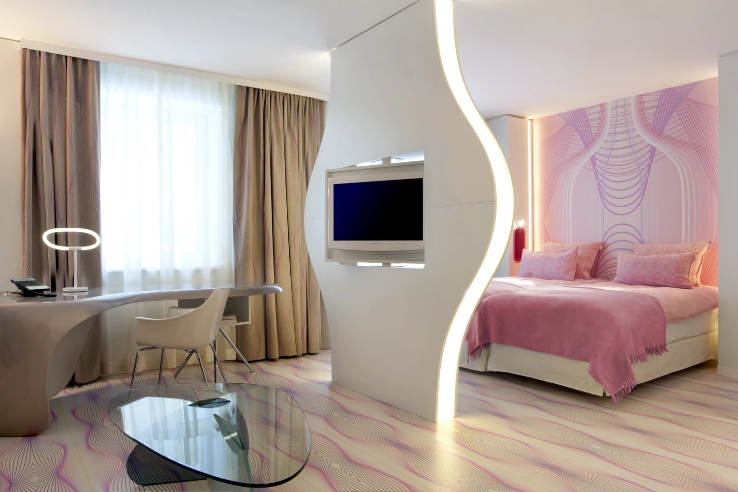 The nhow hotel's Junior Suite living room and bedroom in pink color scheme(Image by nhow Berlin)