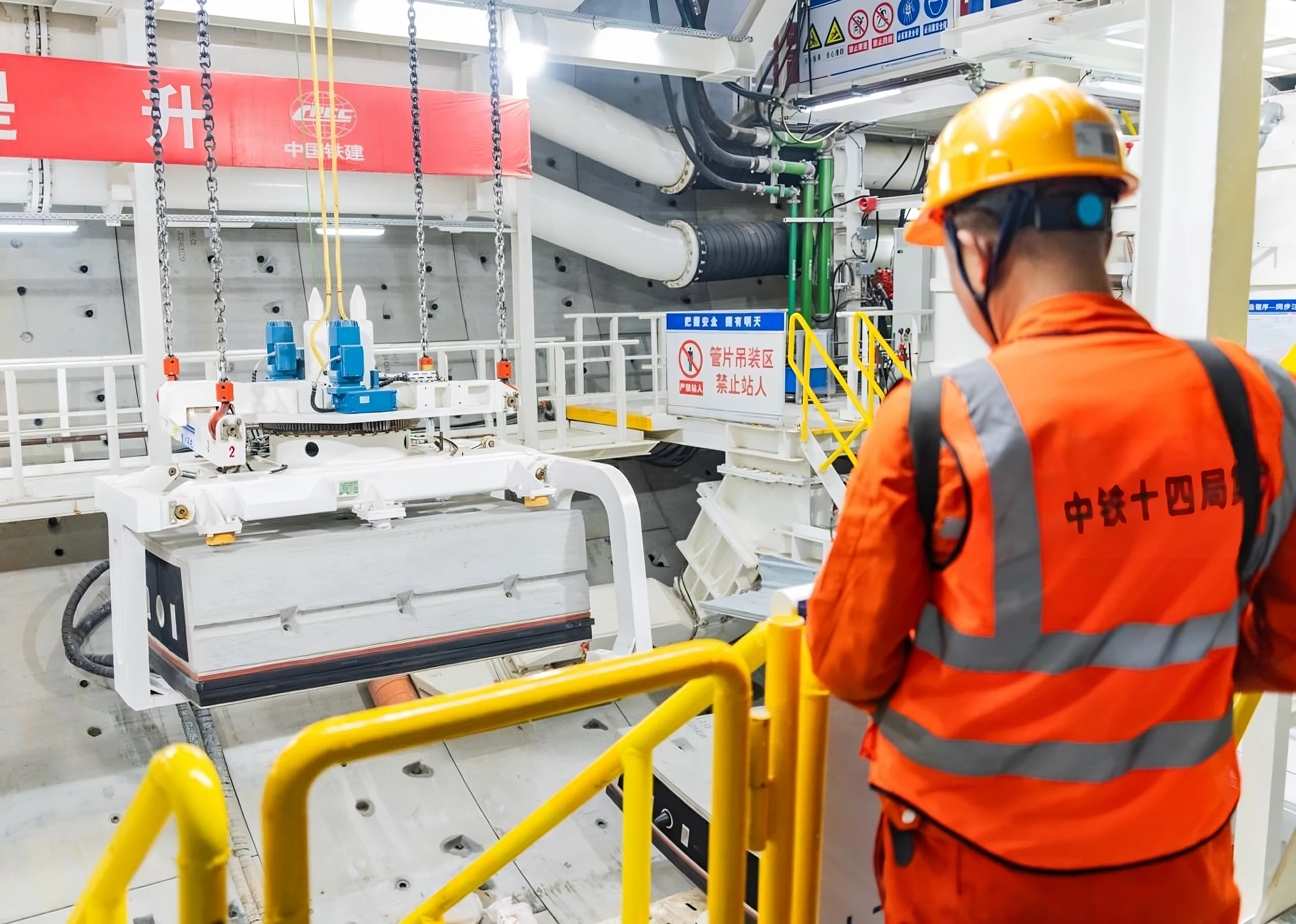 A worker looks on as progress is made