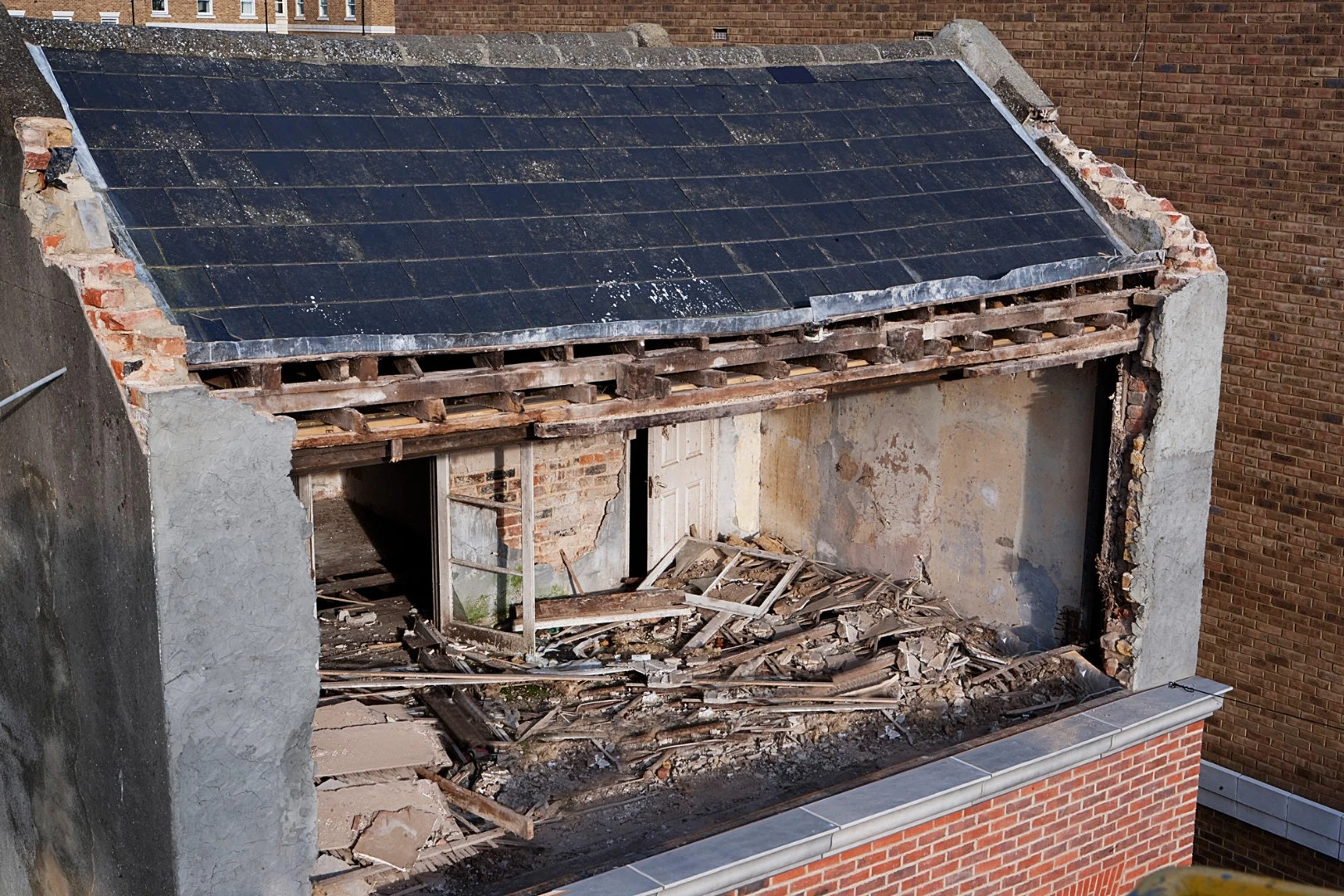 From the knees of my nose to the belly of my toes gave the impression a facade was slipping off the building, revealing a top floor usually hidden behind brickwork