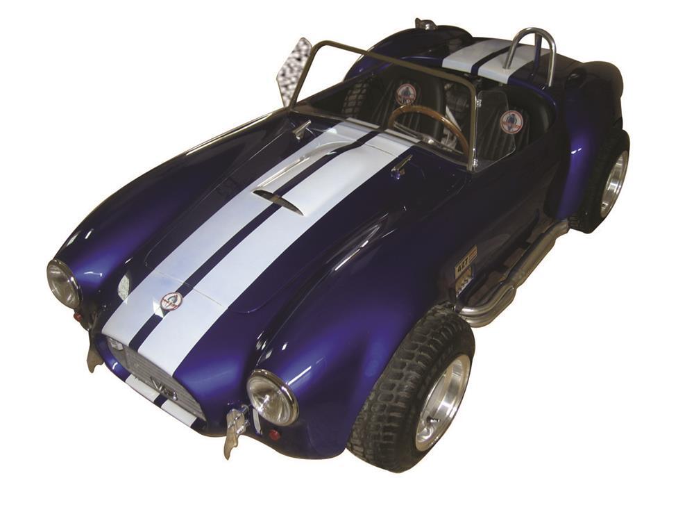 One of the tastiest bits of kit sold in the entire Pratte collection, at least on a bang-per-buck basis, was this one-of-a-kind, half scale Shelby Super Snake Cobra go-kart - just like the real one also owned by Pratte that sold at auction later in the week. The kart was built by McLaren Classic Restorations and has a keyed electric start with two forward gears plus reverse for the 150cc engine, leather interior, working lights, genuine Shelby gauges, a functional hood and passenger door. Whatsmore, the car is autographed by Carroll Shelby himself. The guages and autograph alone must be worth the $28,750 it sold for.