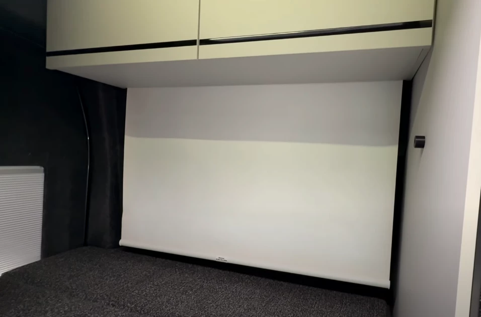 The retractable projector screen delivers in-bed entertainment