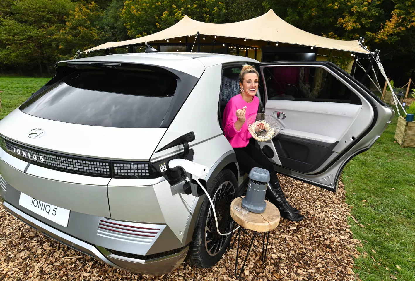 The Hyundai Hotel has been curated with broadcaster Grace Dent, seen here enjoying popcorn and an espresso made with gadgets powered by the Ioniq 5