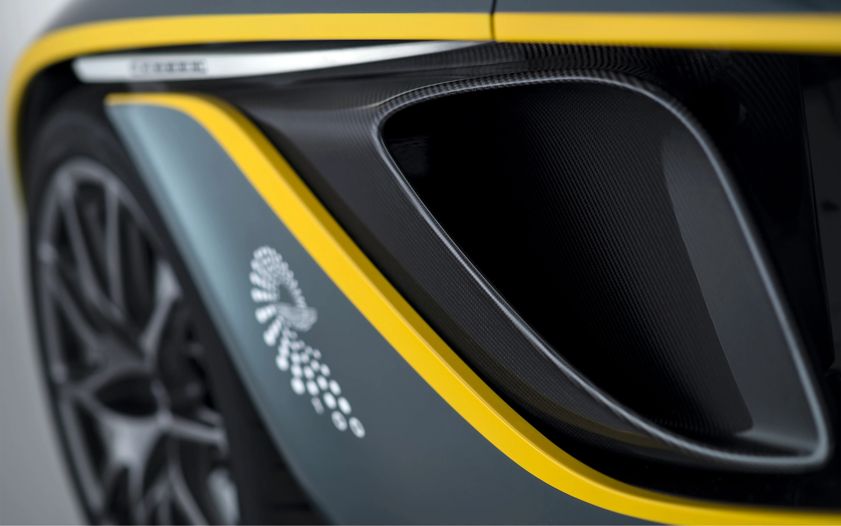 Vents behind the forward wheel arches assist in expelling engine heat
