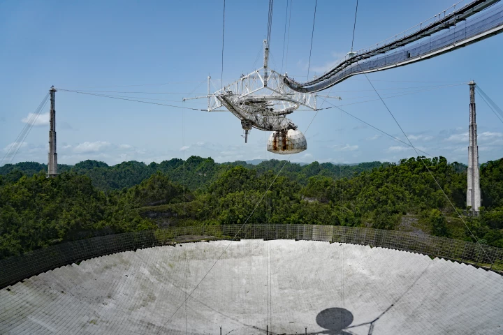The Arecibo radio telescope, pictured here still intact