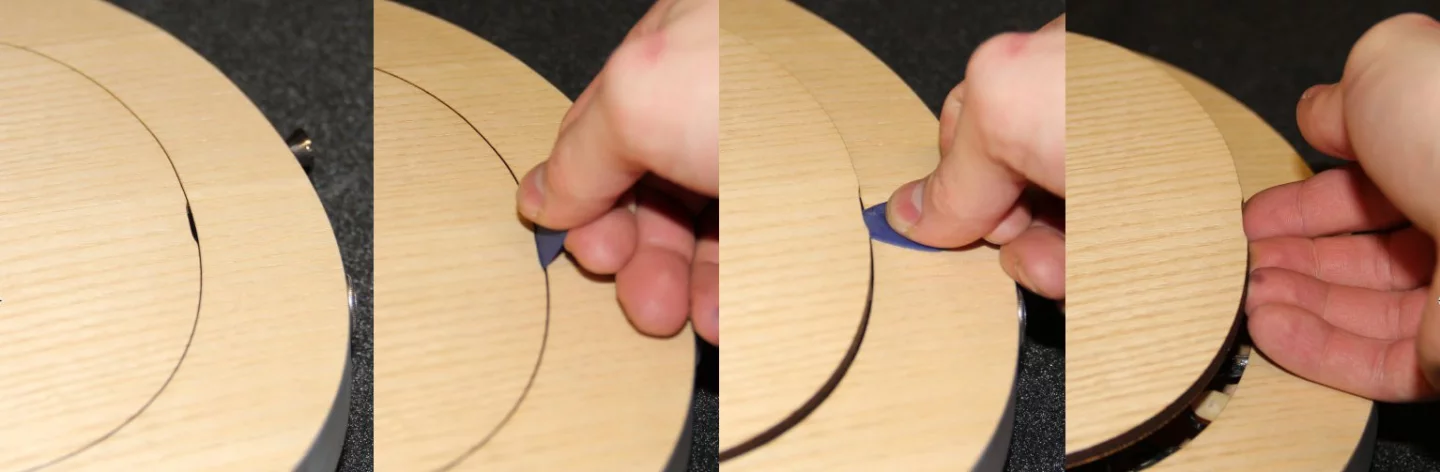 The back plate is held in place by nine magnets and can be removed by slotting a pick into a recess at the back edge and lifting up