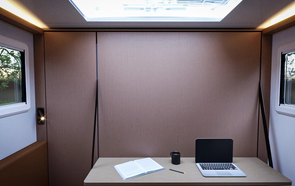 The master bedroom turns into an office space when the Murphy bed is folded and desk dropped down