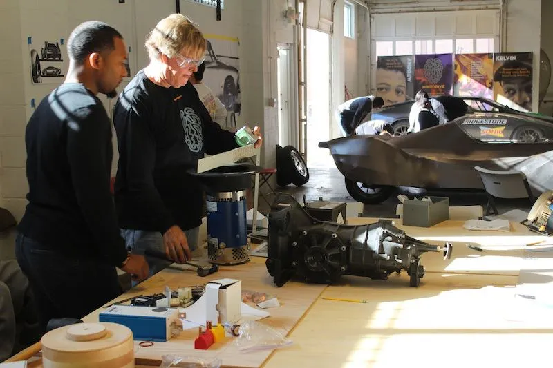 Steve Rees and mentor Elvis Butler check the components