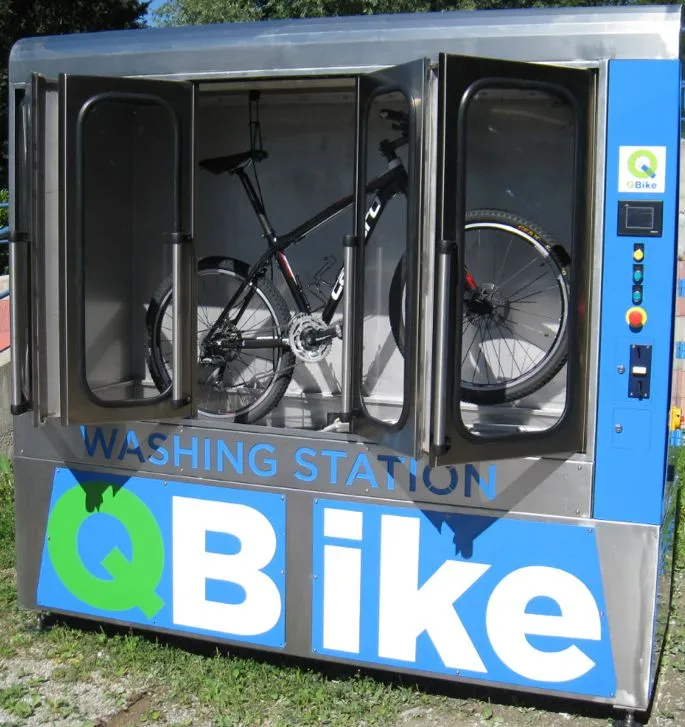 After several minutes, once the wash is over, the bike is removed and dried by hand