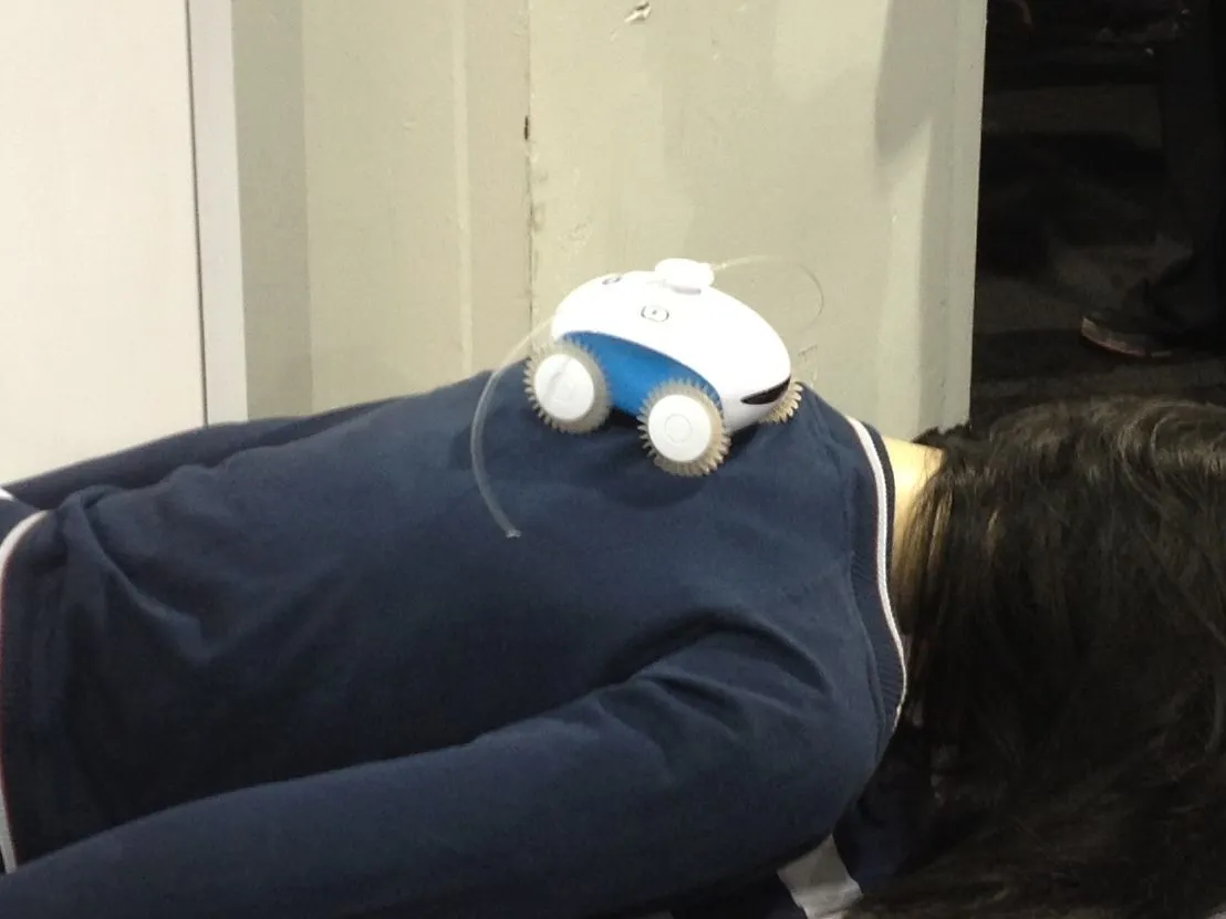 WheeMe giving a massage on the show floor of CES