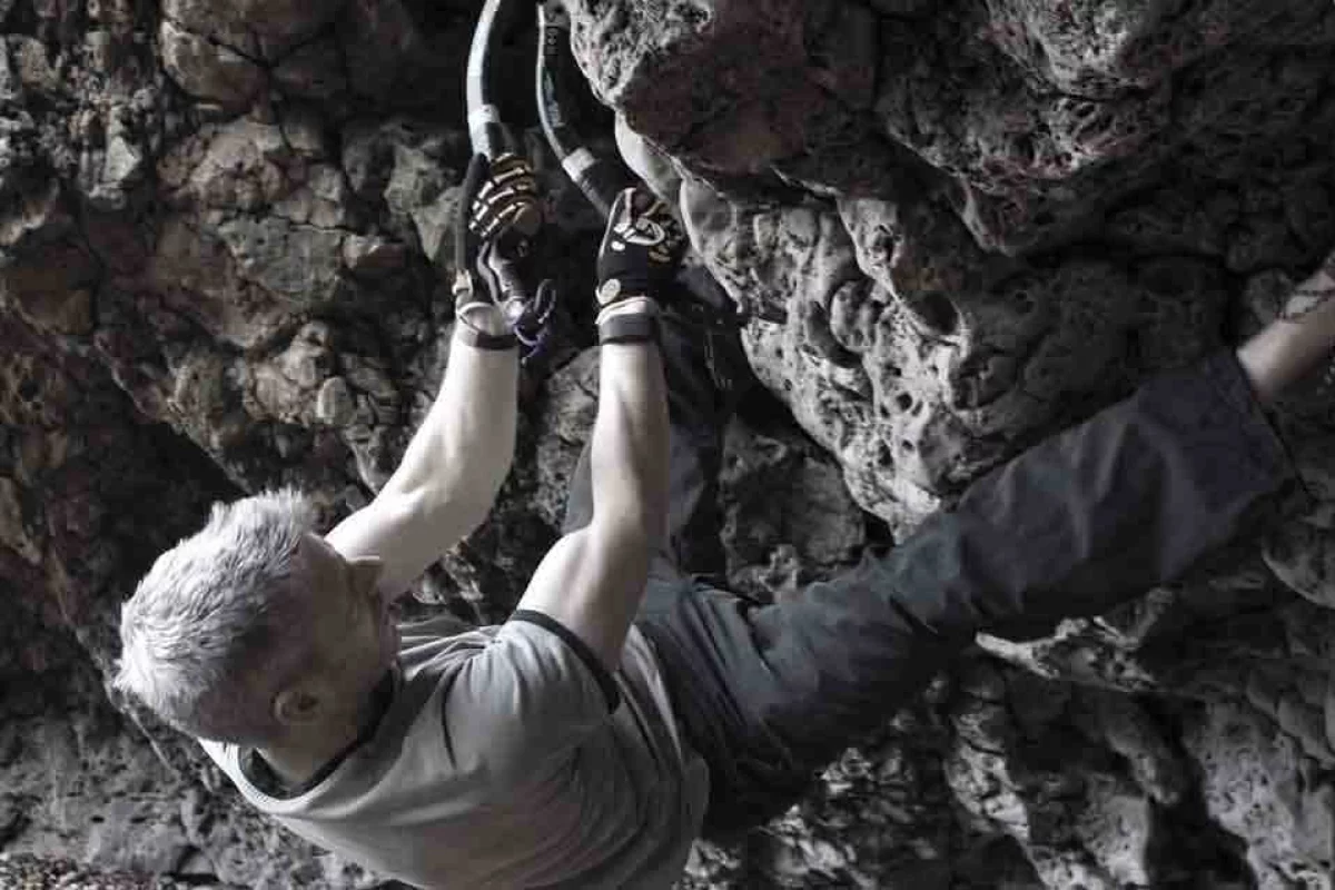 A climber wearing the ClimbAX wristbands