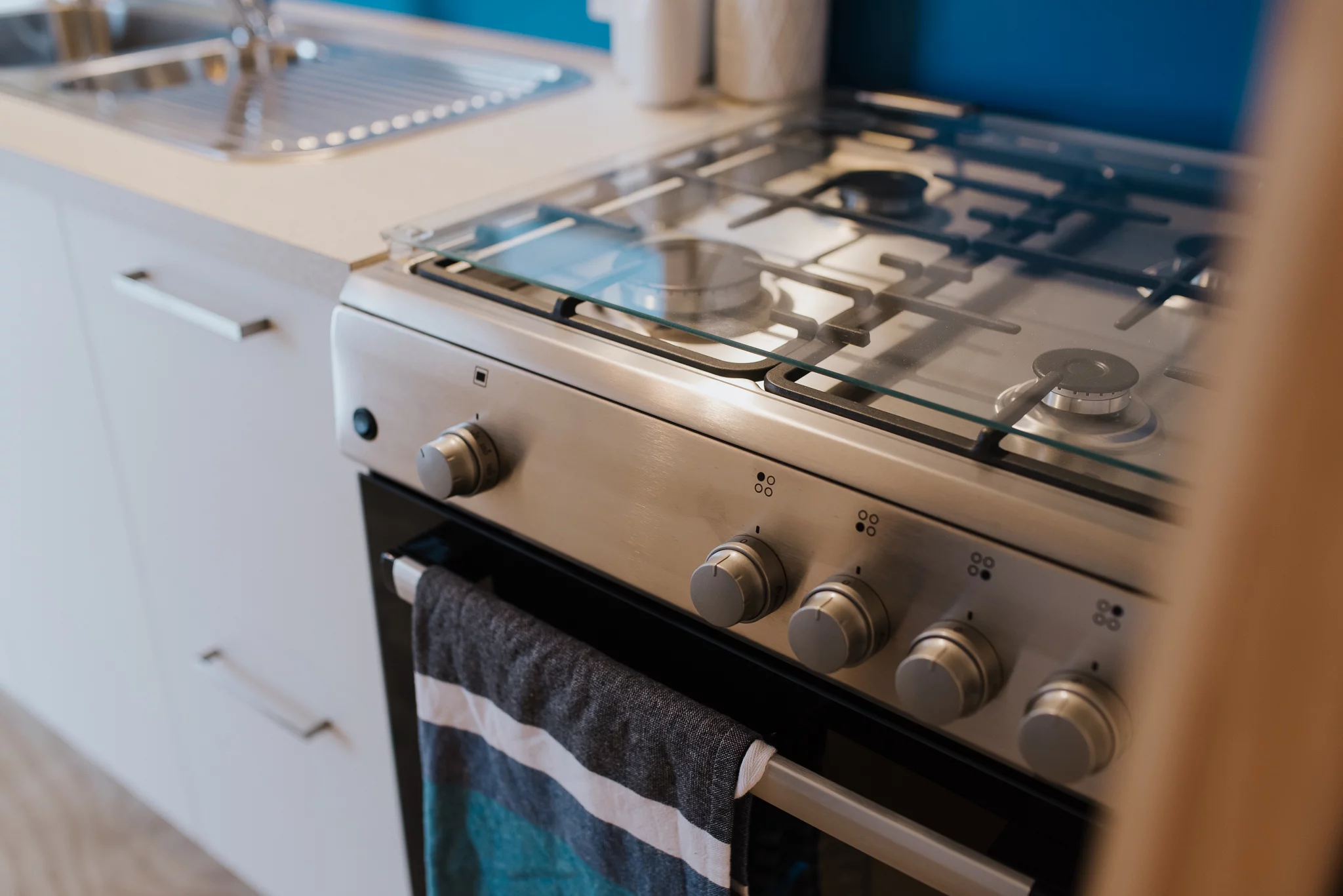 The Total Grace includes a propane-powered oven with four-burner stove