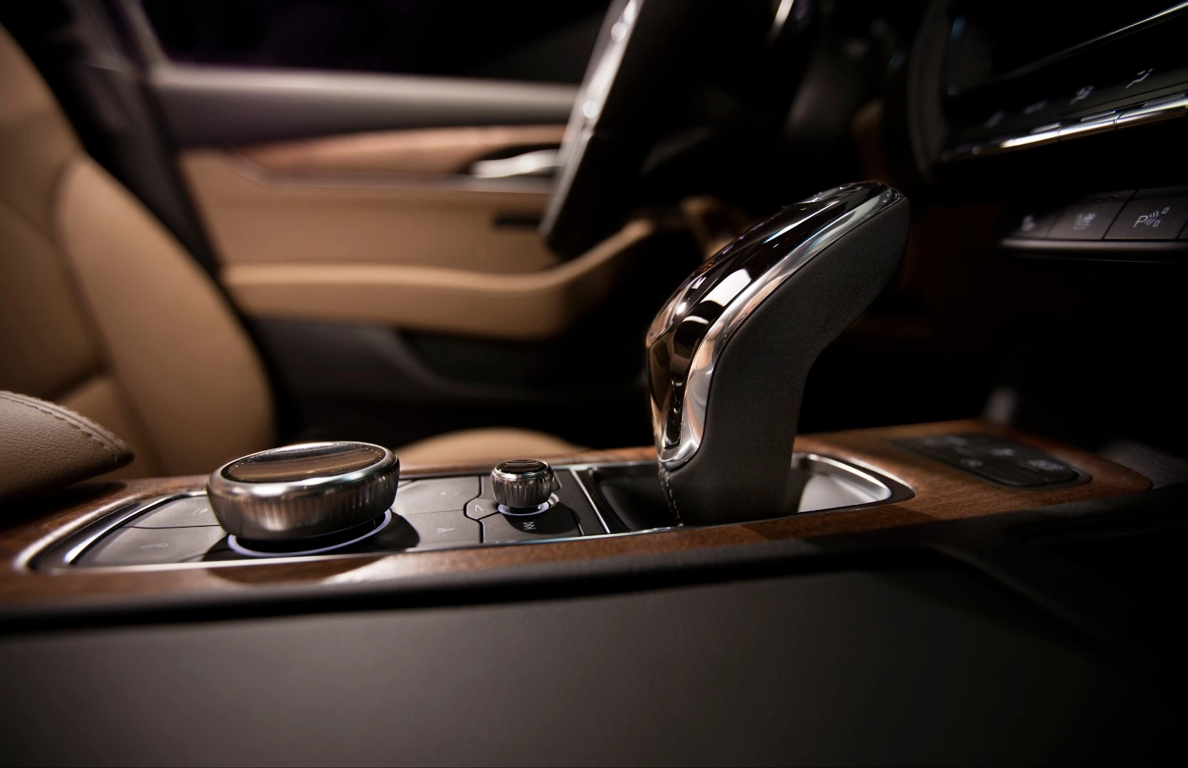 Gear shifting (lever to right) takes equal prominence to the infotainment control knob (left) in the Cadillac CT5