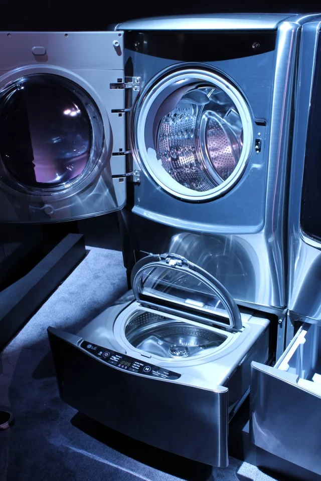 At the heart of the system is the new Mini Washer that sits underneath any of LG's existing full-size front-loading washers, acting as a pedestal for the larger machine (Photo: Eric Mack/Gizmag)