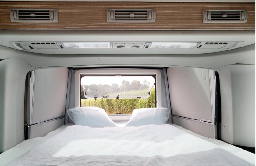 The slide-out bedroom has a large rear window
