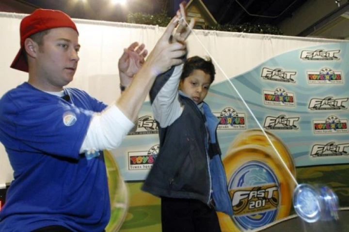 Hans "Yohans" Van Dan Elzen teaches Isaac Duuarte, 7, how to "yo." PIC: Robin Weiner