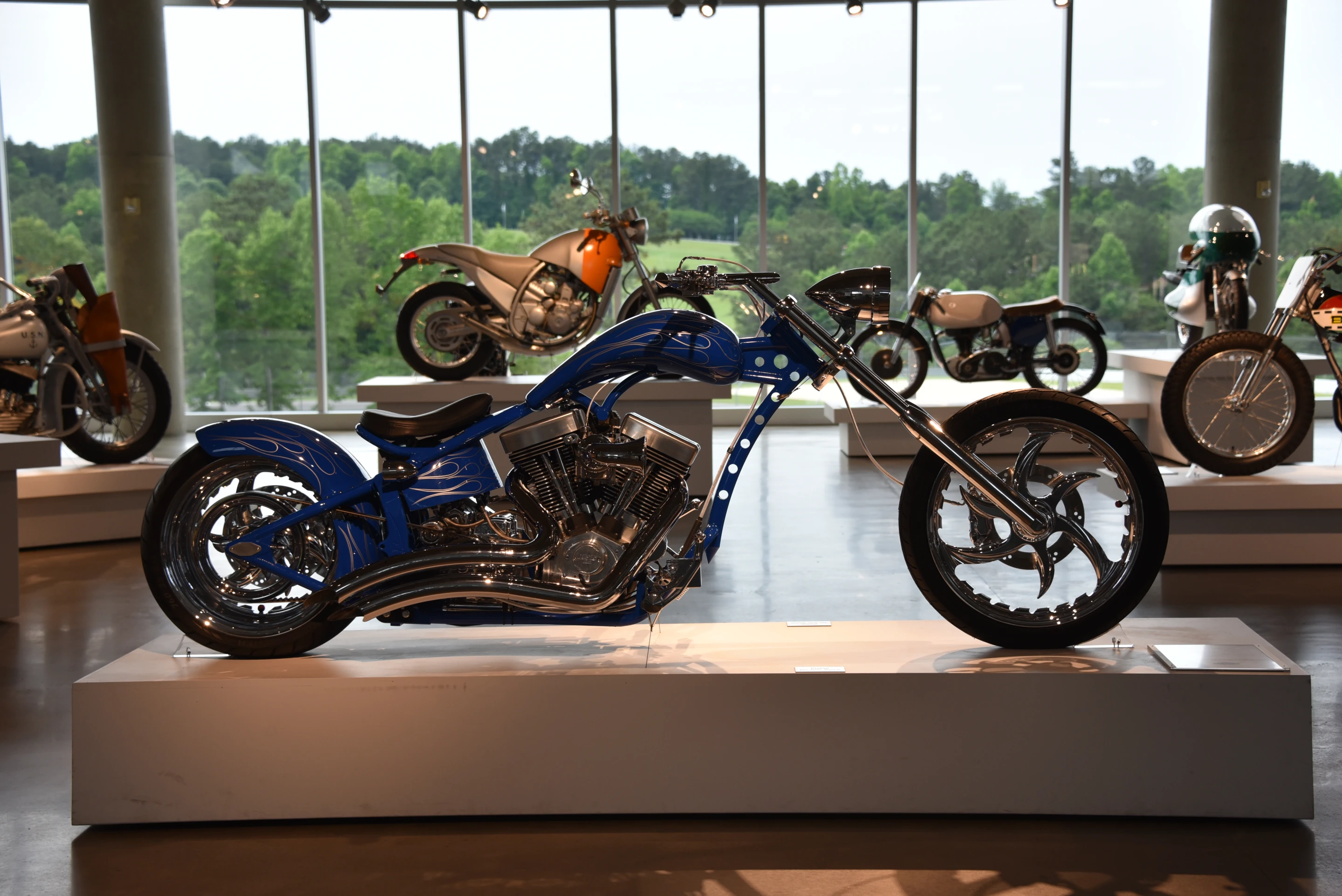 Contrast: Custom chopper sits next to a Michael Graves designed Aprilia 6.5 Moto