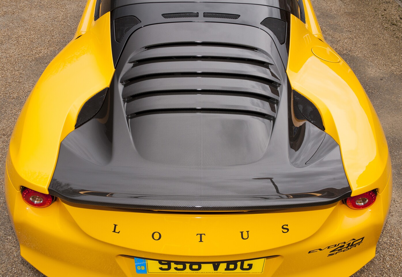 The Evora Sport 410 has a carbon fiber tailgate with integrated rear spoiler and louvered backlight