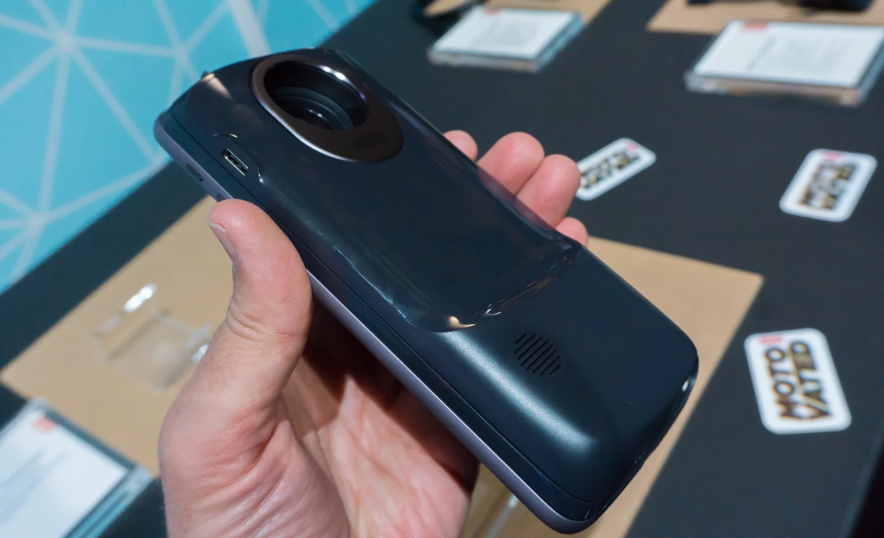 A prototype module that projects a touchscreen-like image onto a flat surface in front of the (propped-up) phone