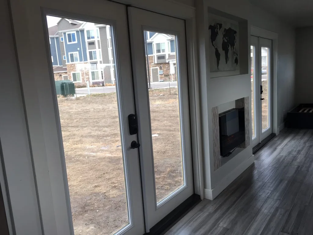 The Intellectual Tiny Home is accessed by two French doors