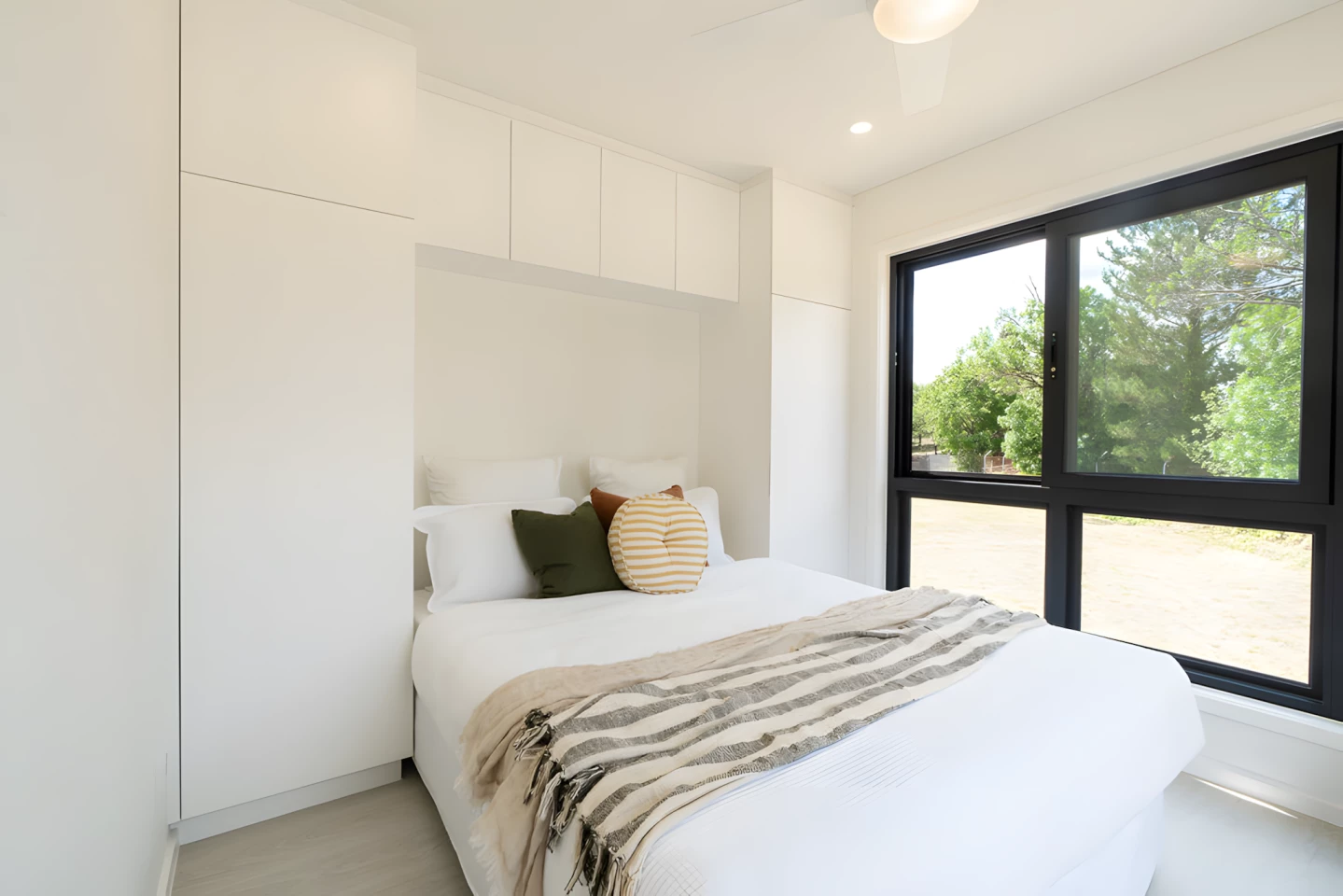The Kookaburra's main bedroom has a double bed and some storage space, plus a small balcony area