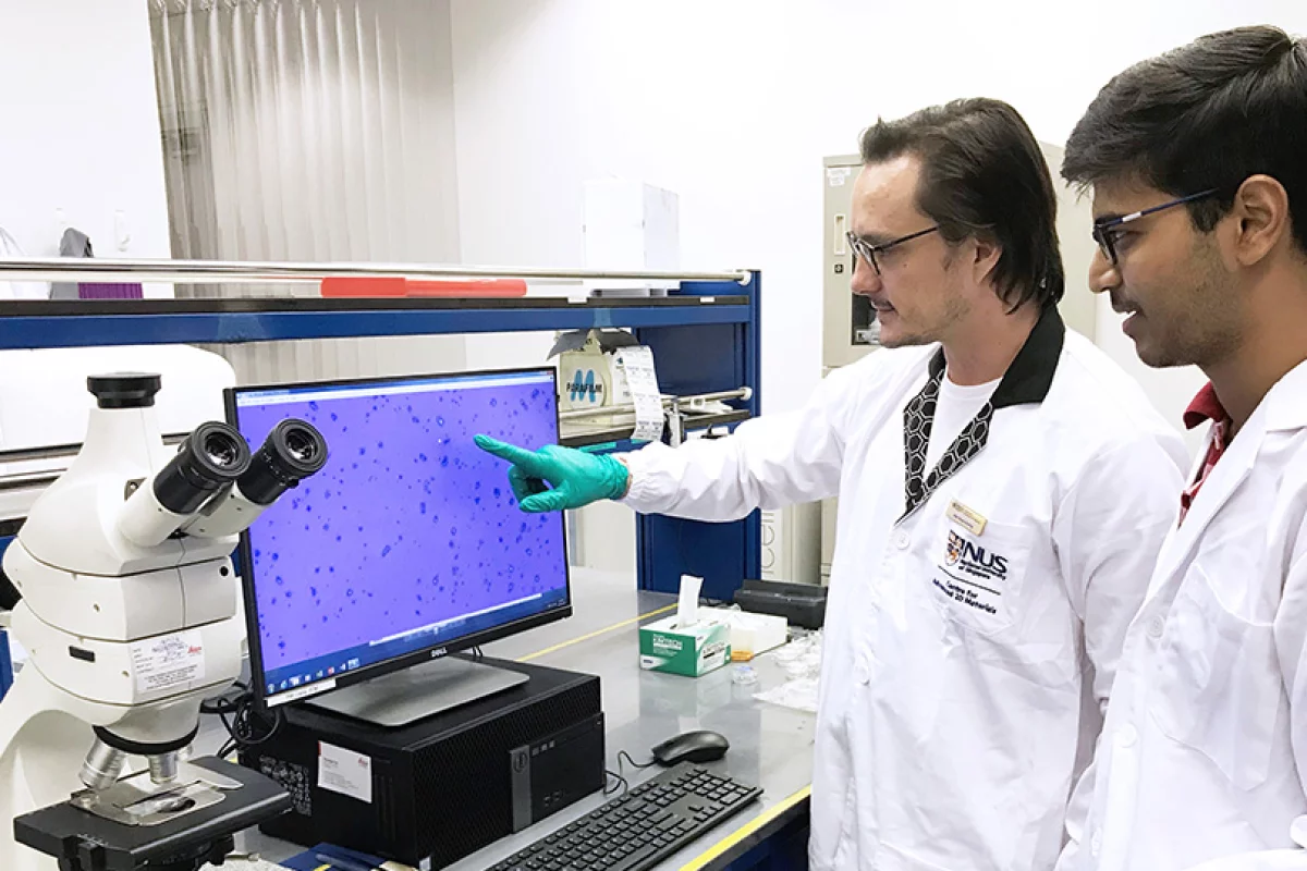 Researchers from the NUS Centre for Advanced 2D Materials assess the quality of graphene samples