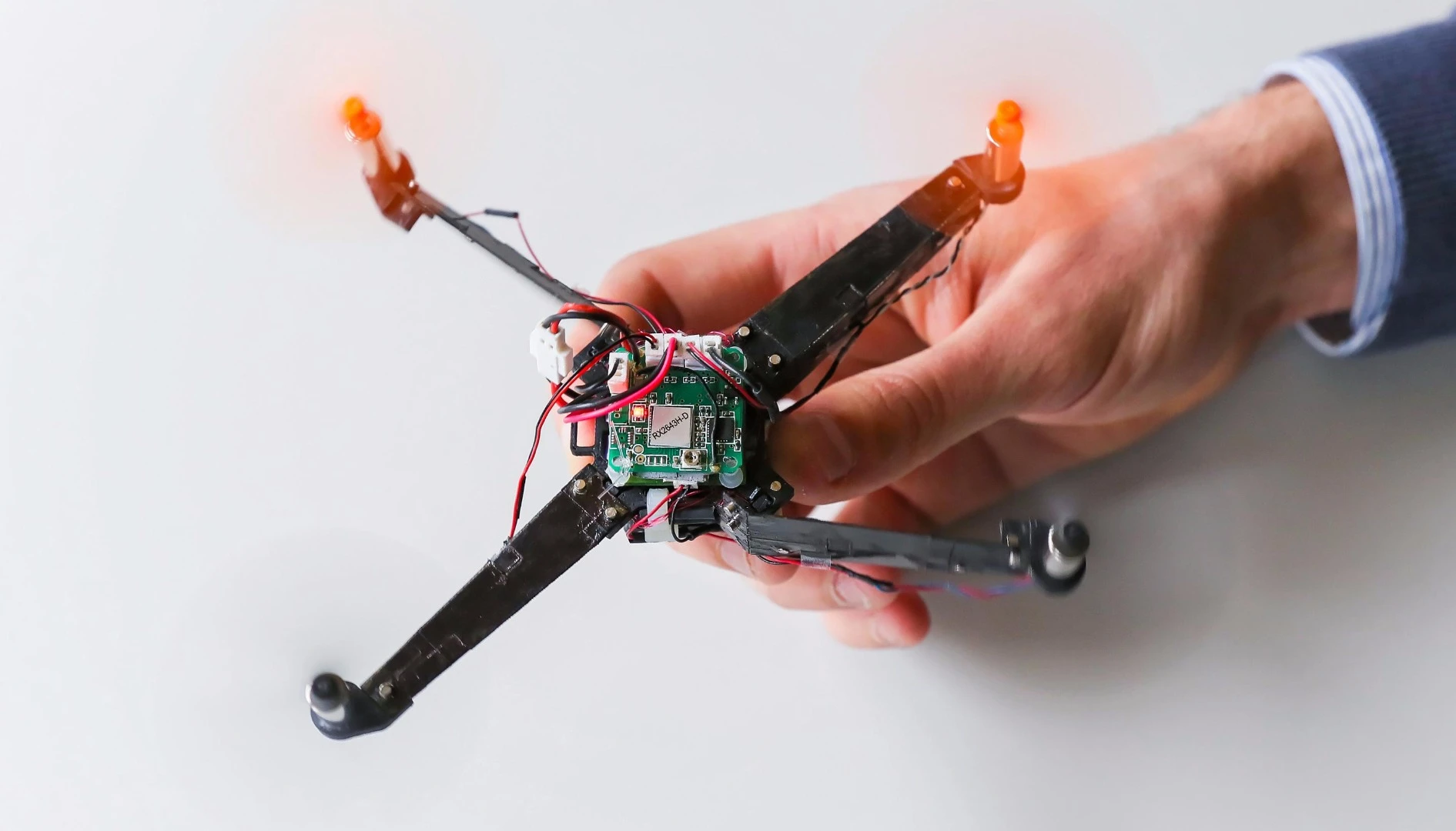 Once fired up, the power of the drone's rotors force the arms into position in one third of a second