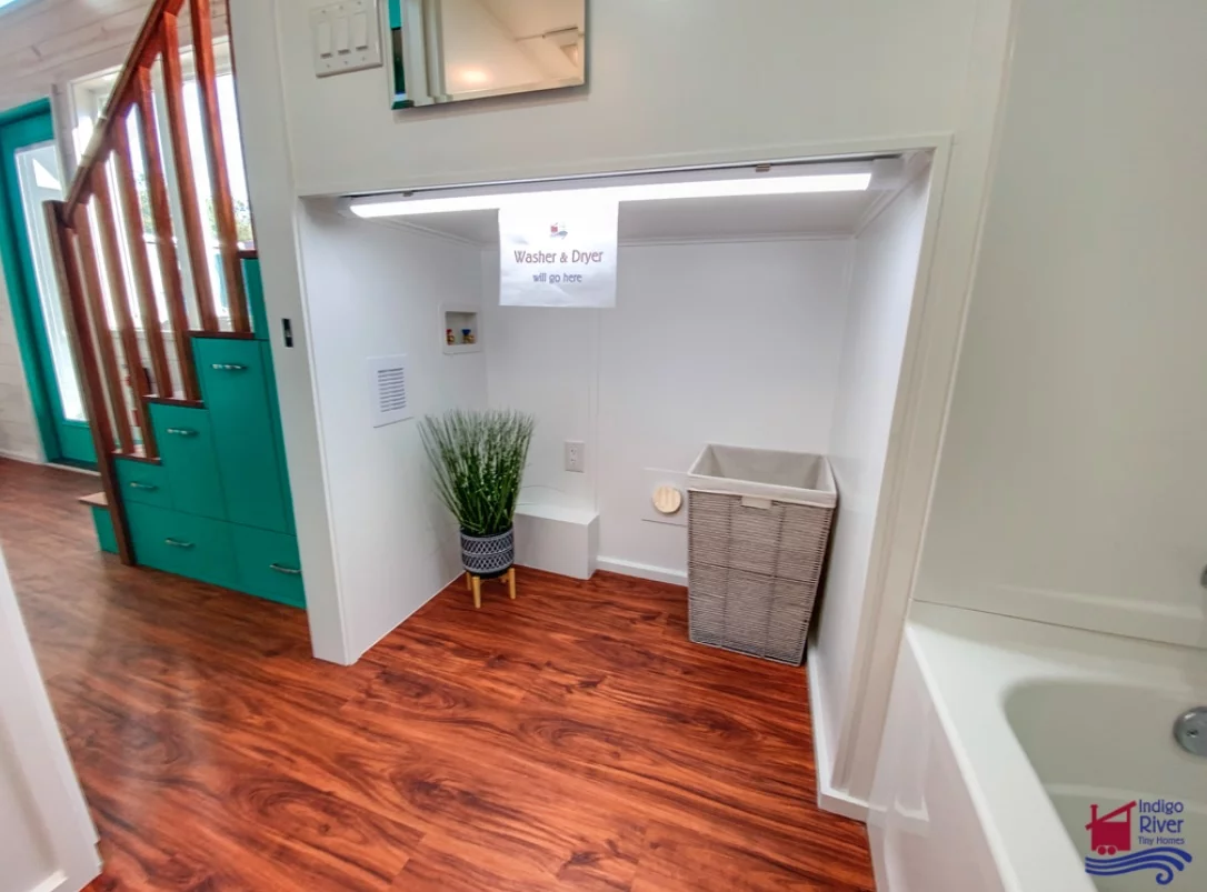 The Sandy tiny house's bathroom has space for a washer/dryer