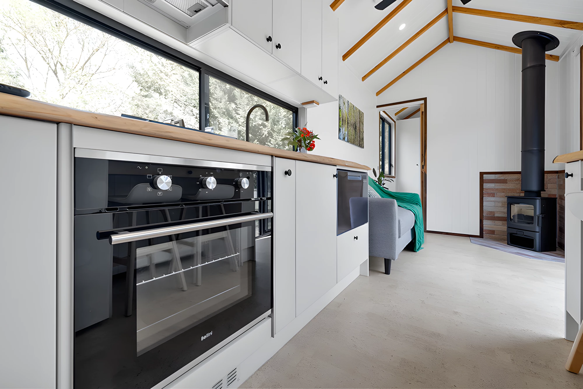 The Casuarina's kitchen includes an electric oven, propane-powered two-burner stove, and a fridge/freezer