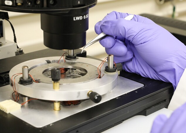 The nanobots are steered by way of six magnetic coils, placed around the outside of the microscope