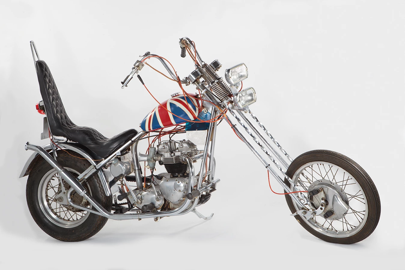 This is the custom Triumph “Sunset Tripper” chopper ridden in the epic documentary film The Song Remains the Same. Led Zeppelin commissioned Ron Hagest, owner of California-based Burbank Customs, to create Triumph-based choppers for each of the band members and this bike was built for drummer John Bonham, inspired by the “Captain America” chopper from Easy Rider.