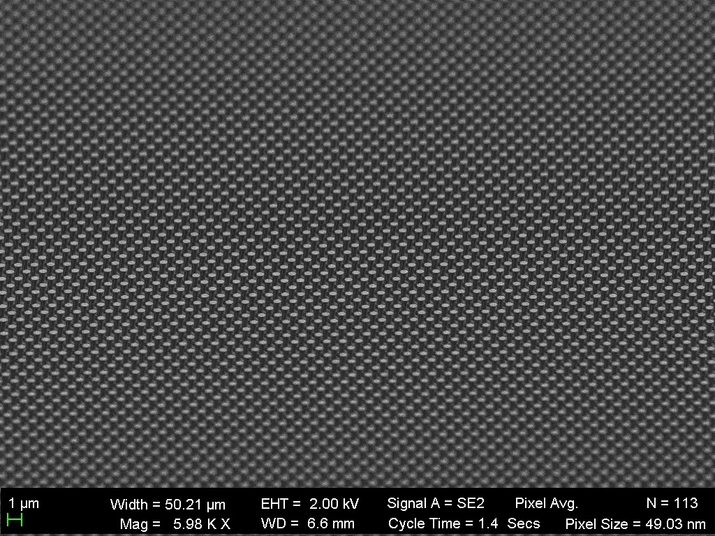 Microscopic image of the diamond sheet mirror bearing structures shaped like tiny golf tees