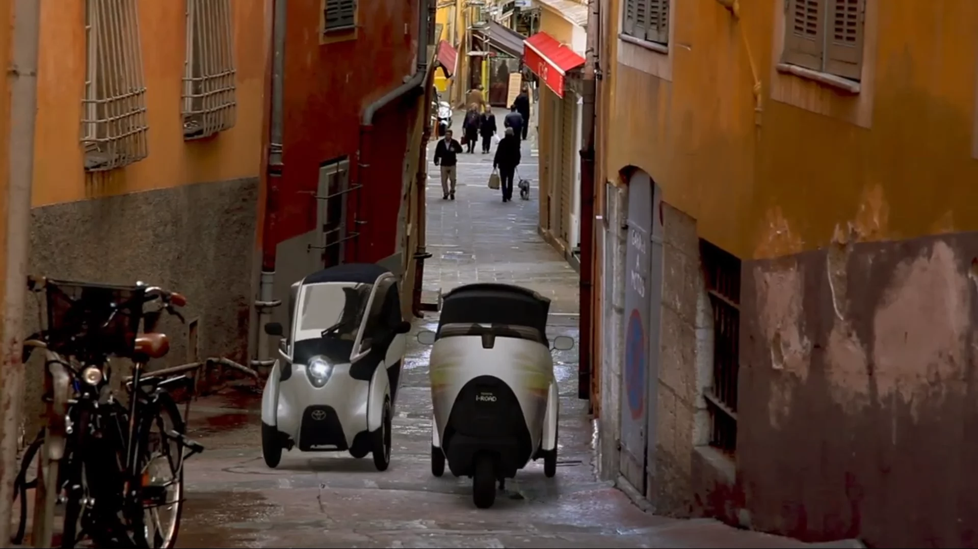 Toyota's i-ROAD is a fully-enclosed, two-seater, three-wheeled, fully-electric, Personal Mobility Vehicle (PMV)