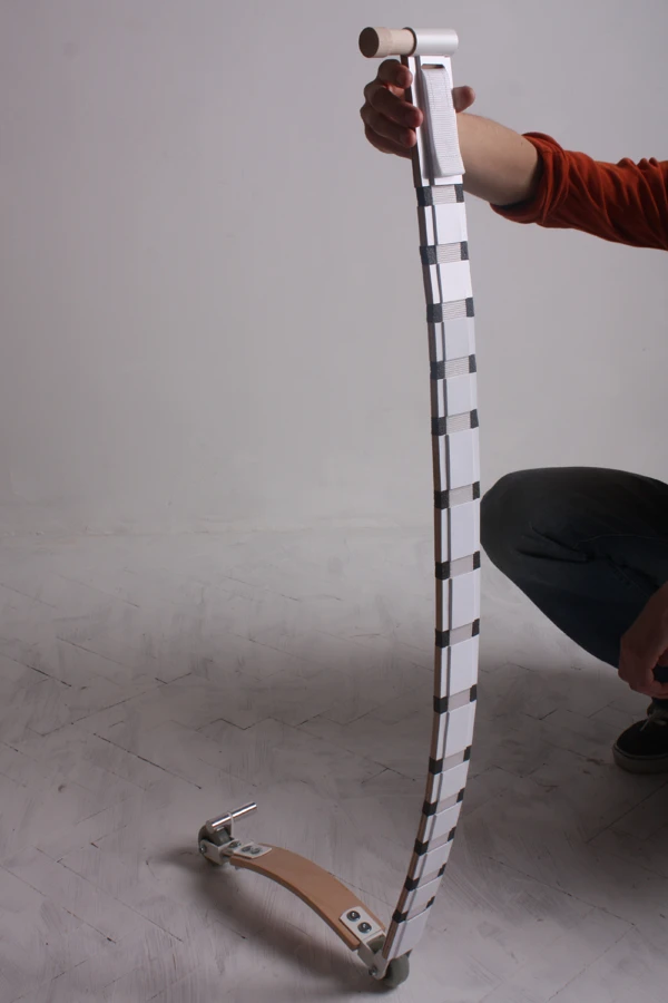 Once tightened, the strap pulls the segments together to stop them from flexing