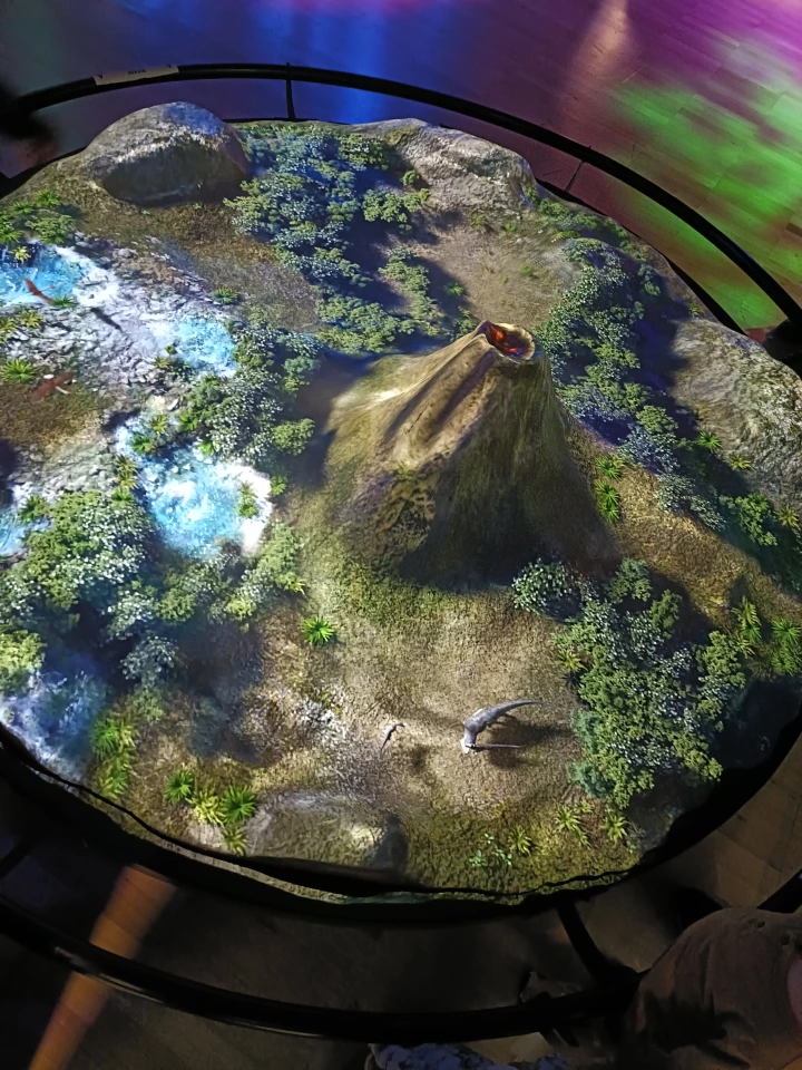 Projected images help visualize the life of Tyrannosaurus rex, while interactive displays let you