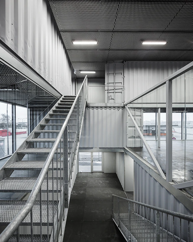 "The interiors of the containers can be used for secondary functions such as meeting rooms, workshops and storage," adds the firm