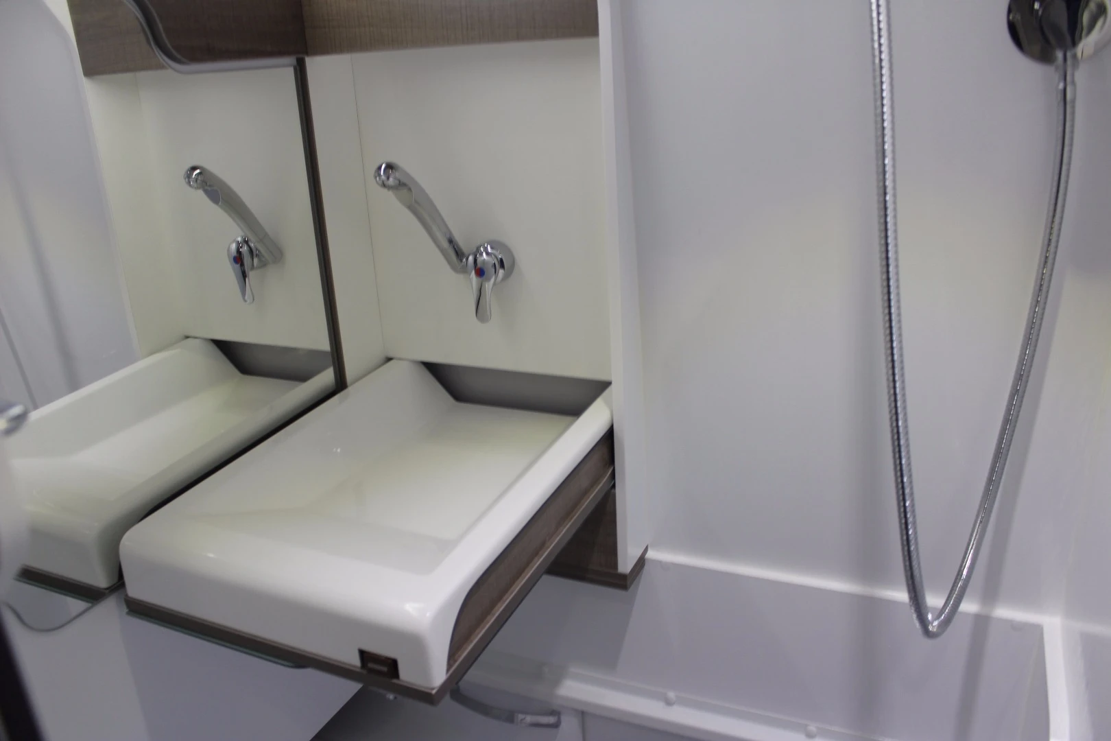 The Mooveo bathroom also includes a foldaway sink