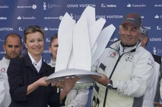 Valencia Louis Vuitton Act 13Prizegiving Alinghi: Brad Butterworth, skipper, receives the trophy from Christine Belanger, Louis Vuitton Cup Director.