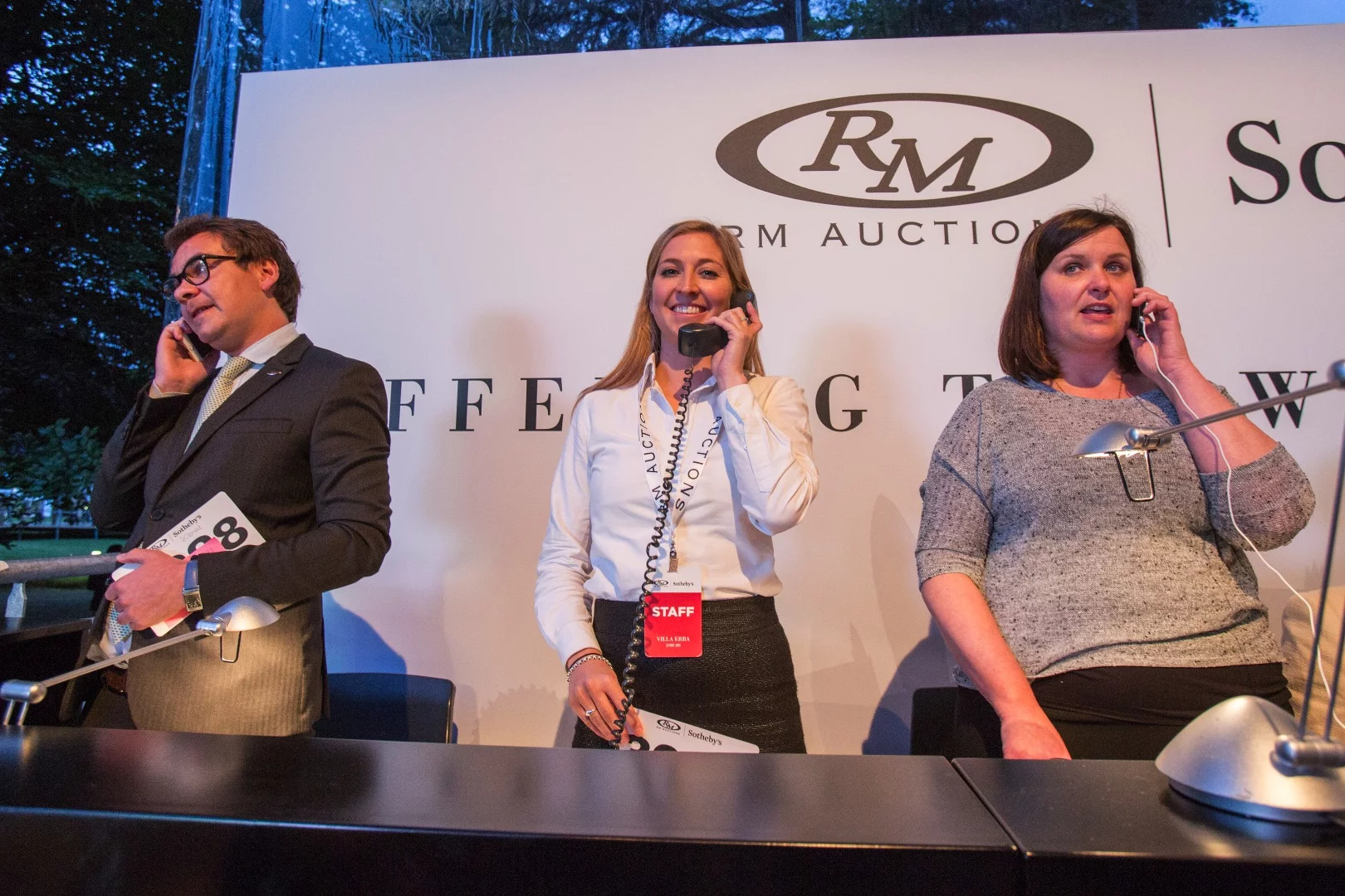 RM-Sotheby's staff service international telephone bidders during the Villa Erba sale on May 23, 2015.
