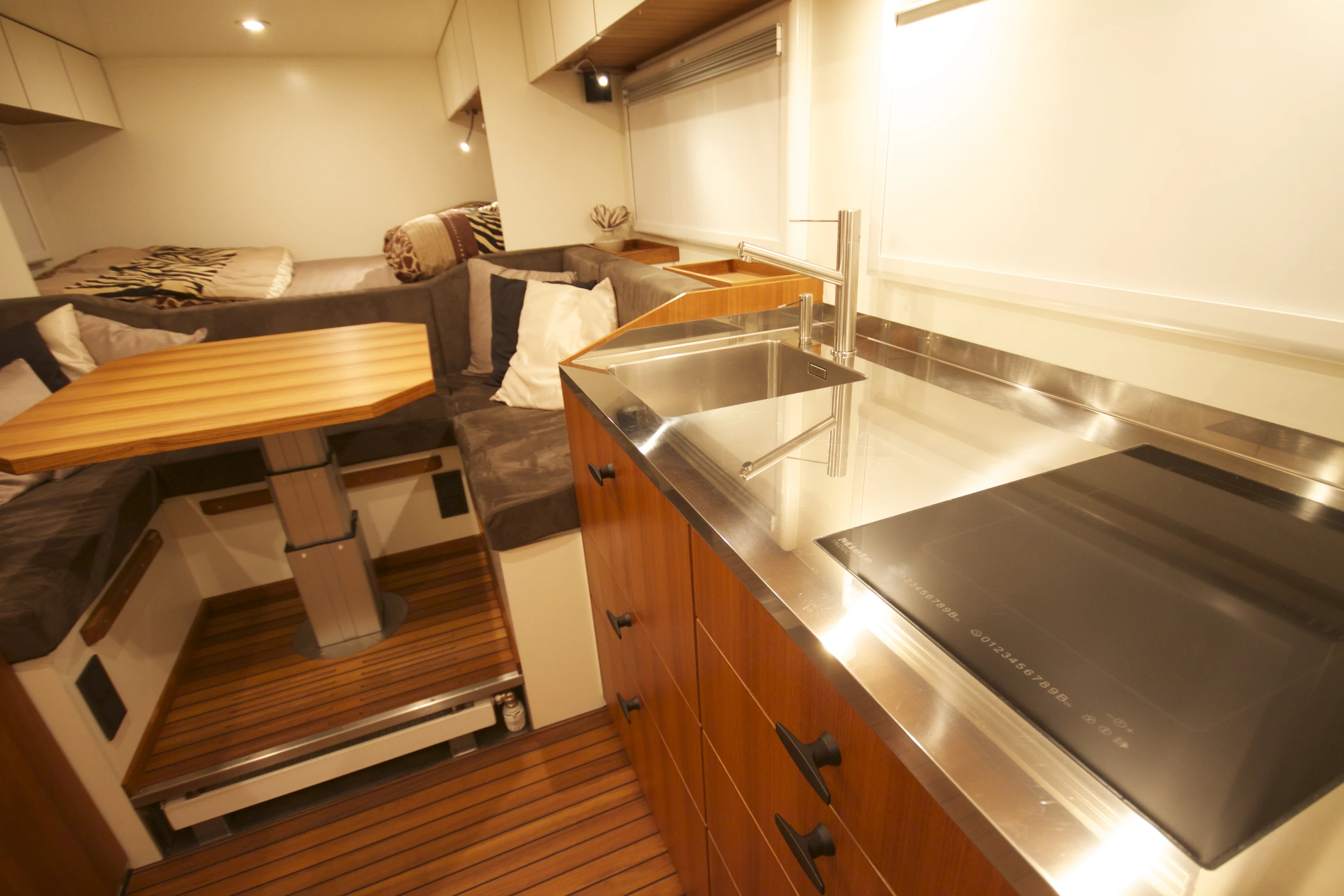 Inside, Unicat uses a lot of teak wood and a stainless steel countertop