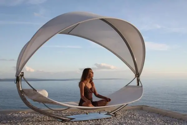 Surf lounge is suspended in mid-air, offering the comfort of traditional hammocks but with style