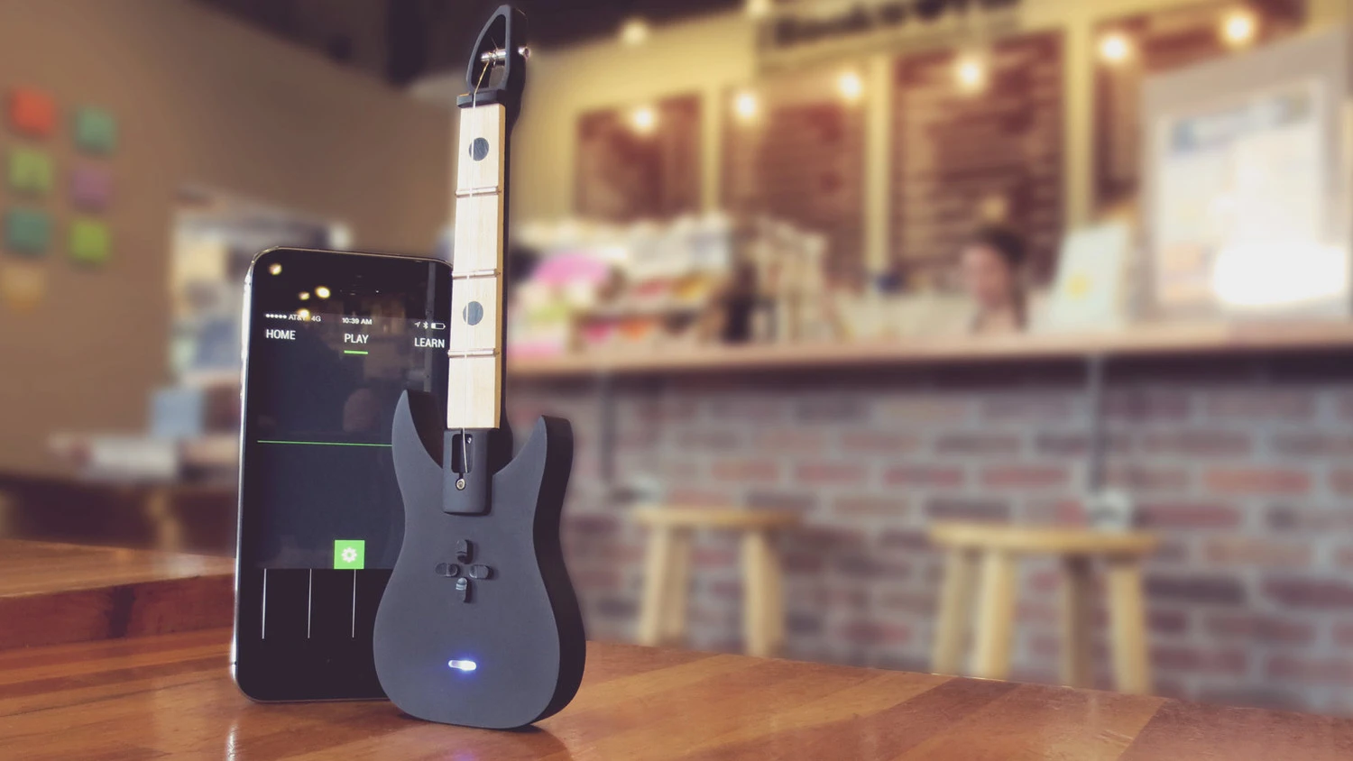 The FretPen offers players three full octaves from just three frets on a real wood neck and a companion iPhone app