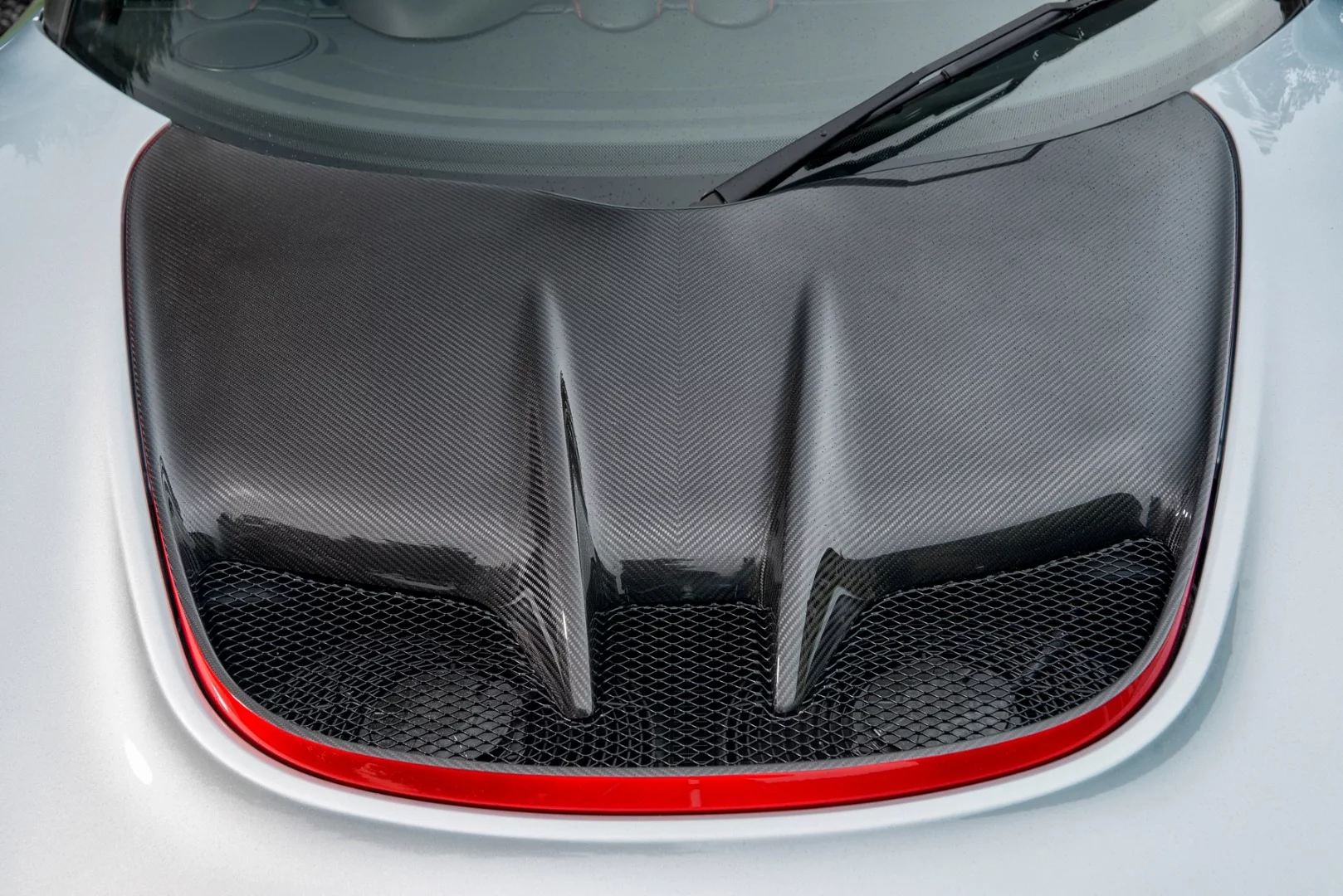 The Lotus Exige Sport 380 has a carbon fiber front access panel